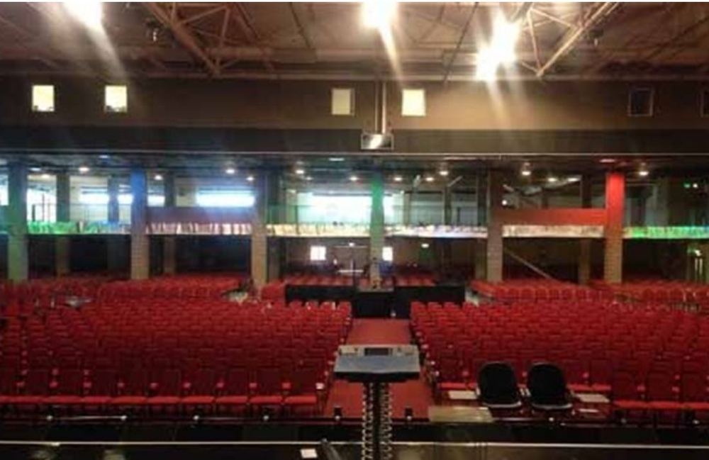 Completed large-capacity worship auditorium with tiered red seating