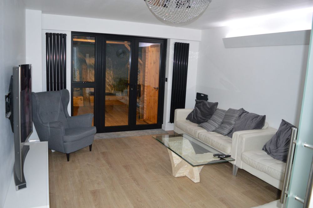 89 Talbot Road — Living room with bifold doors